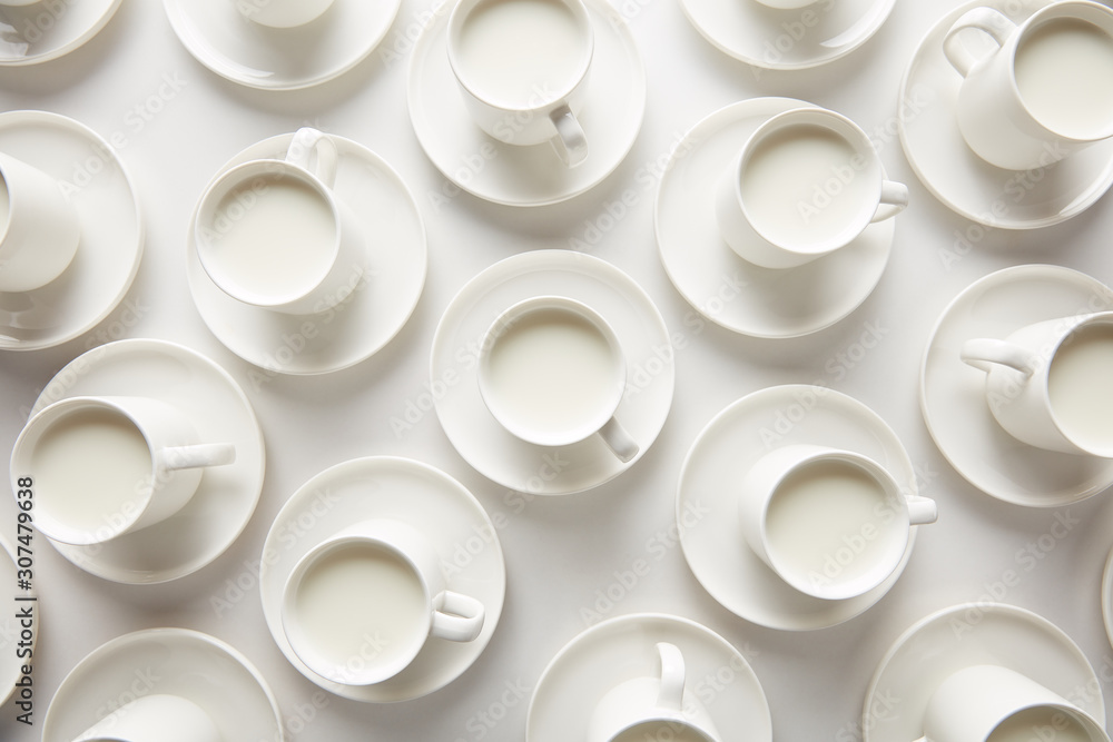 Layout of white cups with milk Layout of white cups with milk