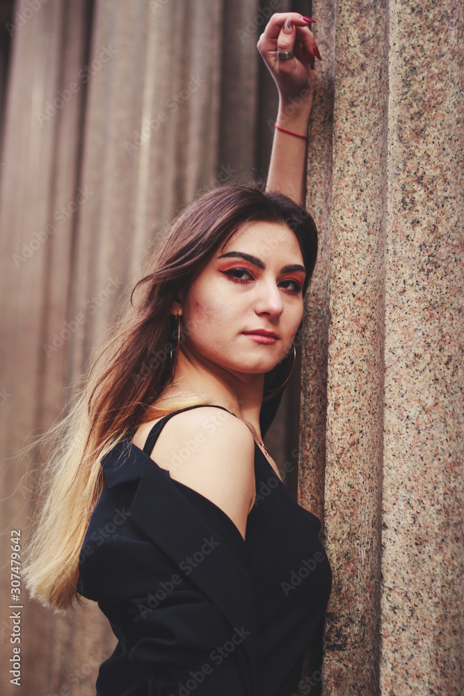 Model in black dress and long jacket. Style. Fashion trends 2020. Hair with ombre. Business lady. Blogger. Work Model in black dress and long jacket. Style. Fashion trends 2020. Hair with ombre. Business lady. Blogger. Work