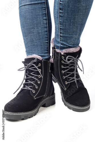 demi-season women s boots black on the feet in jeans on a white background