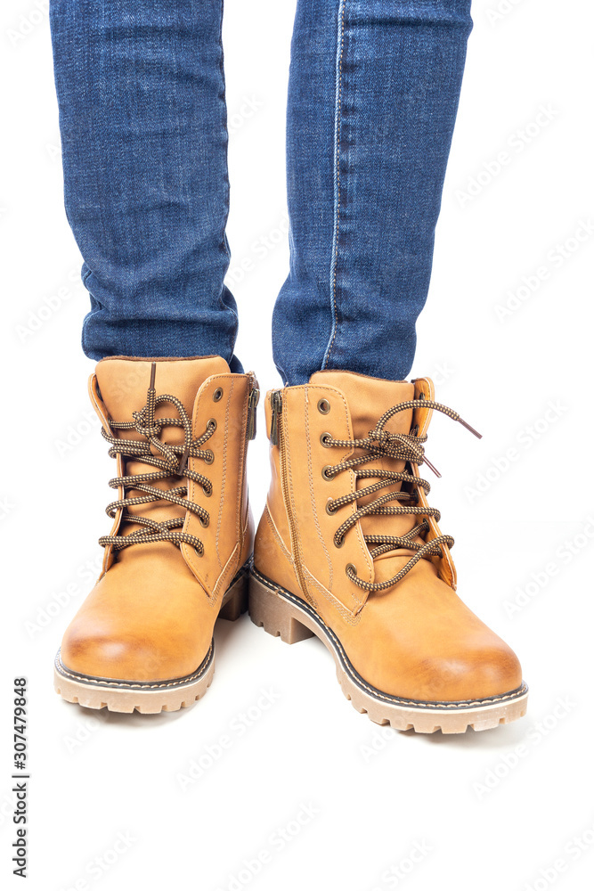 demi-season, women's shoes, yellow, on the feet in jeans, white background, laces, laced demi-season, women's shoes, yellow, on the feet in jeans, white background, laces, laced