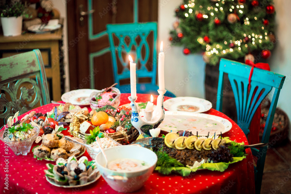 New Year or Christmas interior and festive table with a food.