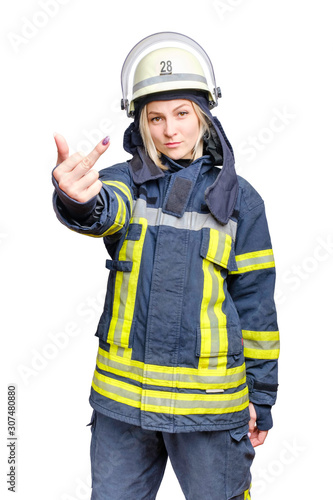 Young pretty firefighter showing middle finger gesture isolated