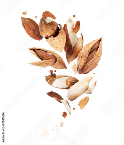Crushed almonds frozen in the air isolated on a white background