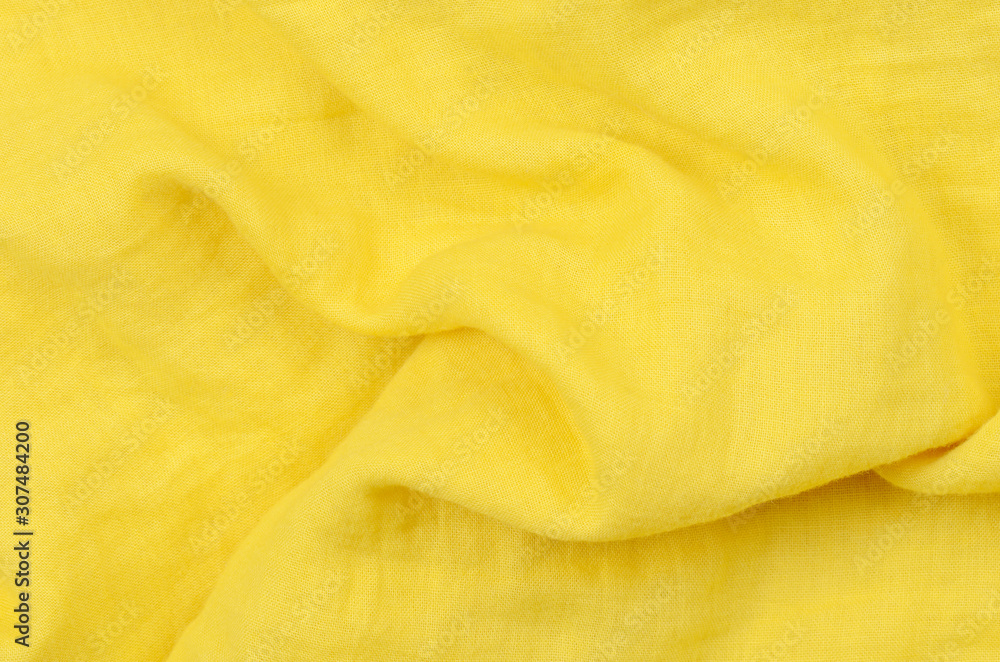 close up crumpled yellow cotton fabric background close up crumpled yellow cotton fabric background
