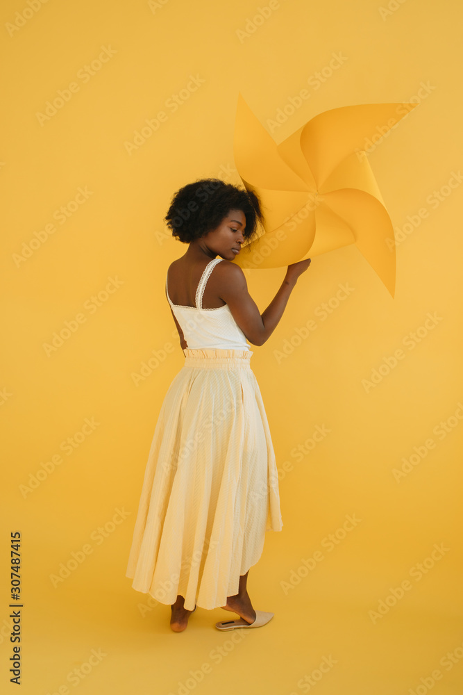 Sensual black female with pinwheel Sensual black female with pinwheel