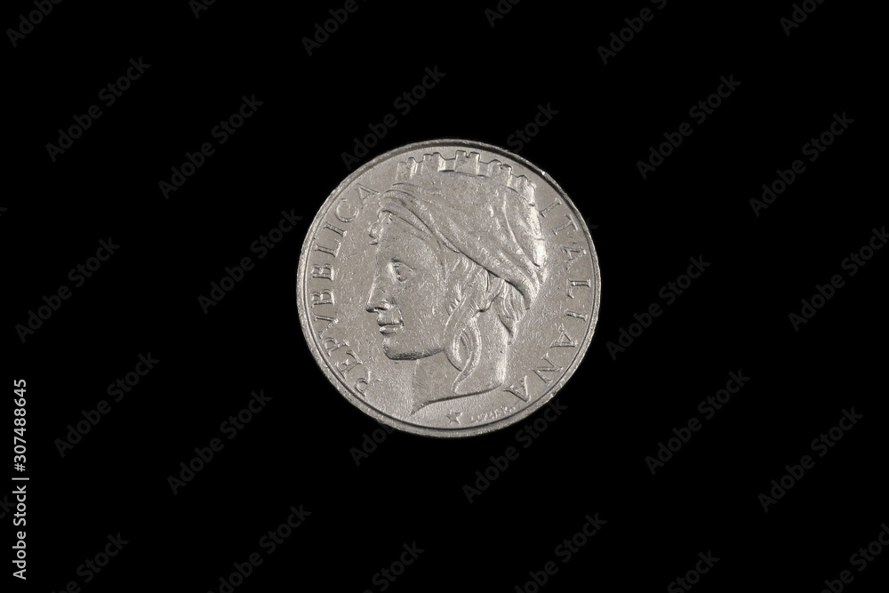 A close up image, shot in macro of an old Italian one hundred lira coin, shot against a black background A close up image, shot in macro of an old Italian one hundred lira coin, shot against a black background