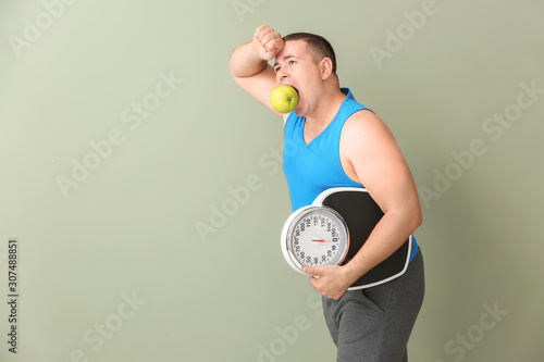 Tired overweight man with s...