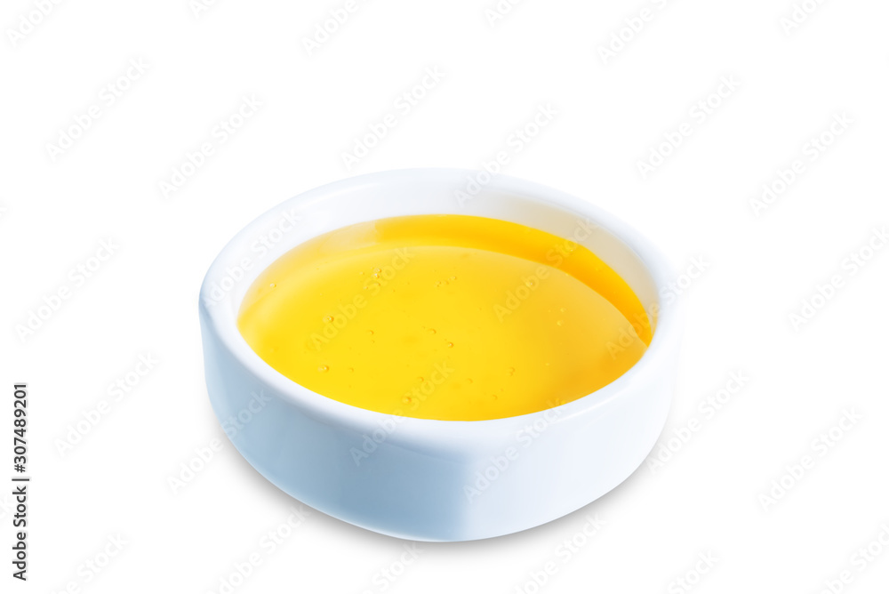 Honey in white bowl on a white isolated background