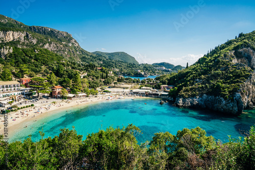 Azure waters of Ionian sea and golden beach Agios Spiridon in Palekastrica, Corfu.