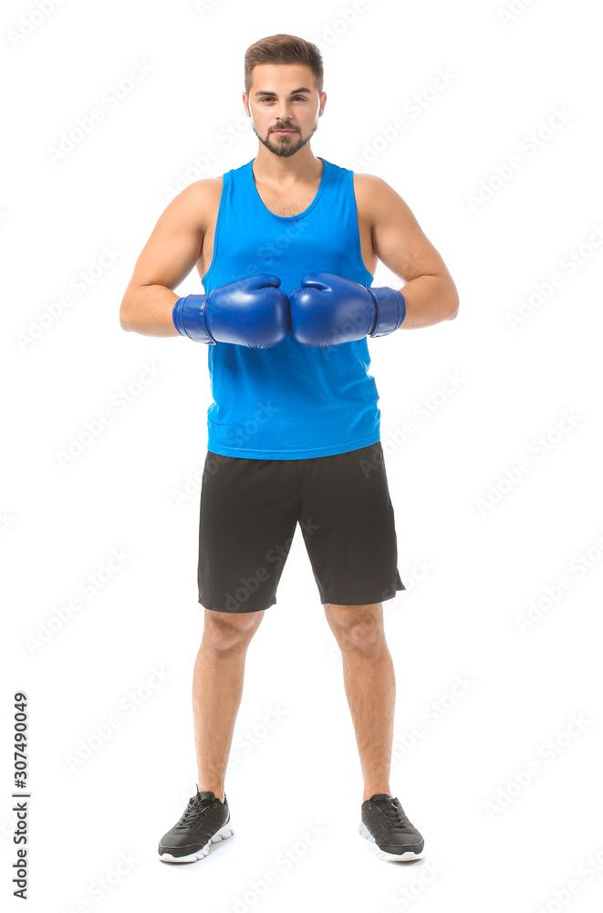 Sporty young boxer against white background