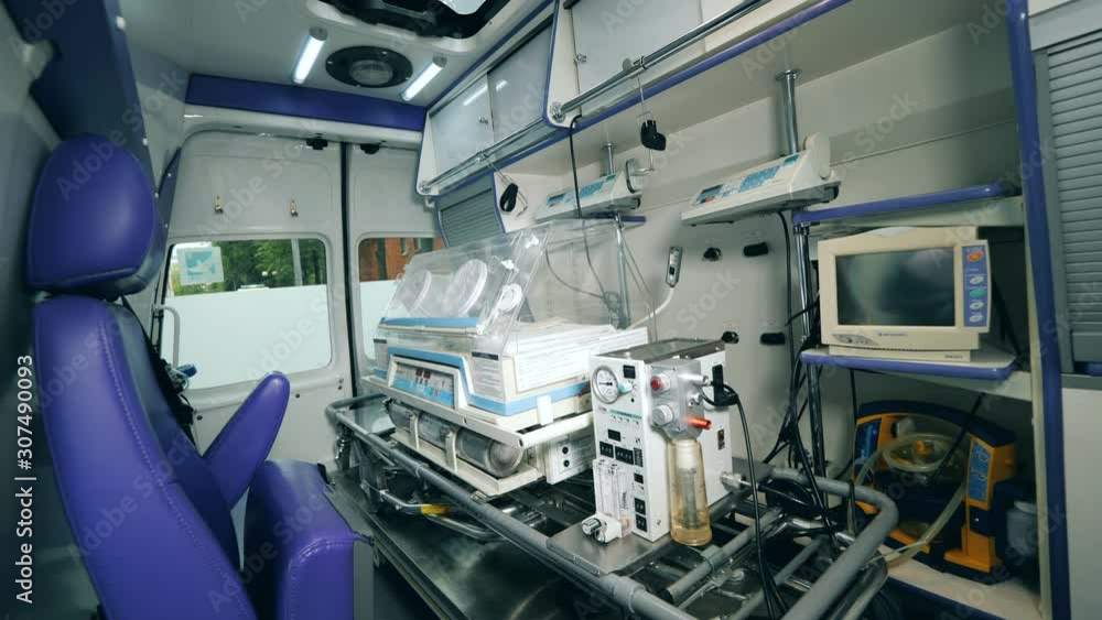 Interior of a medical car with a baby incubator in it Interior of a medical car with a baby incubator in it