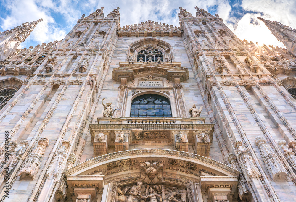 Milan Cathedral in Italy, known as Duomo di Milano is the largest and most complex Gothic building in Italy. Catholic church made of white marble.