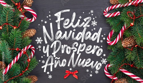 Christmas card with wishes words in Spanish "Merry Christmas and a happy new year!"