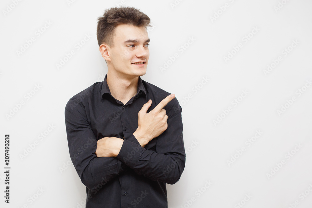 Man having and idea. Young hipster man looking in the camera and pointing up with a nice face. Happy young guy pointing up. With copy-space. Man having and idea. Young hipster man looking in the camera and pointing up with a nice face. Happy young guy pointing up. With copy-space.