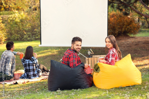 Young couple in outdoor cinema