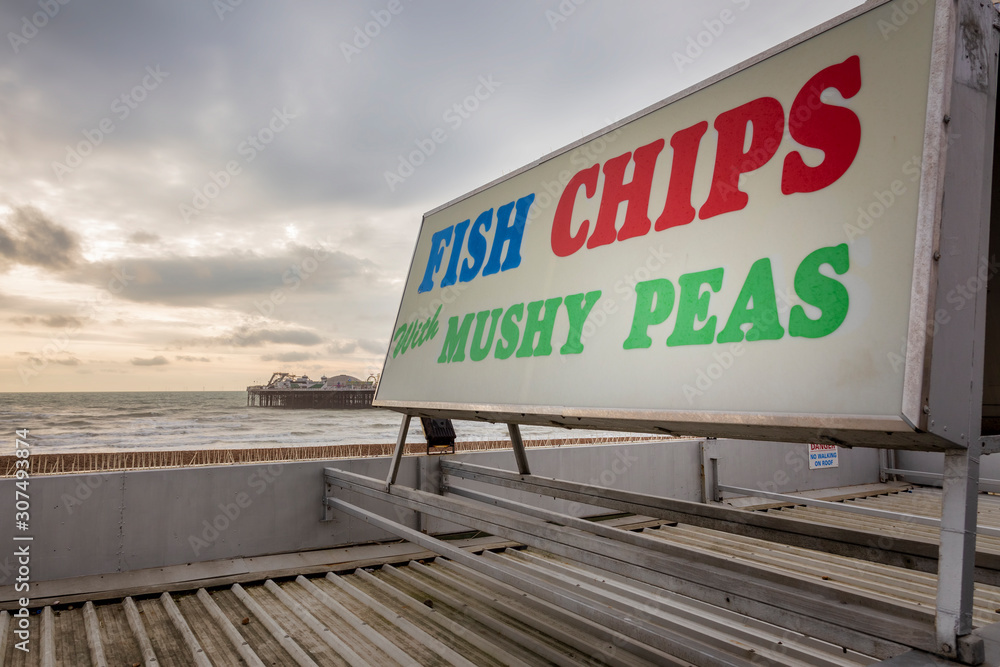 sign at brighton pier for fish and chips