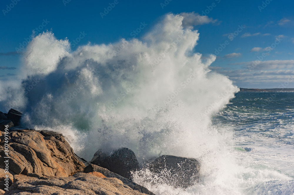 Waves breaking against rocks