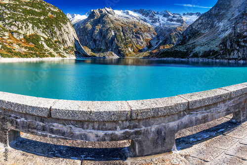 Gelmer Lake near by the Grimselpass in Swiss Alps, Gelmersee, Switzerland photo