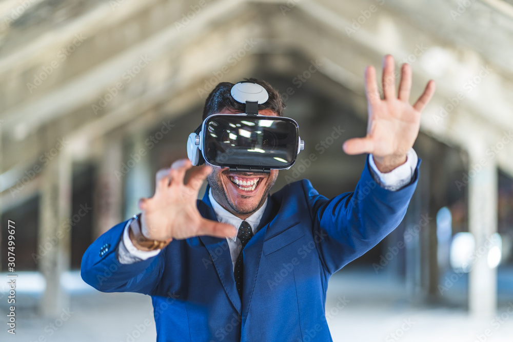 Business Man Wearing Virtual Reality Glasses Indoors. Business Man Wearing Virtual Reality Glasses Indoors.