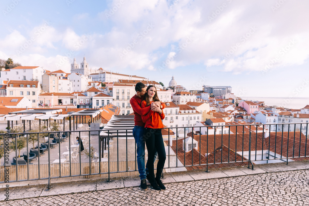 Lisbon, Portugal - 20 January, 2019. the guy hugs the girl from Lisbon, Portugal - 20 January, 2019. the guy hugs the girl from