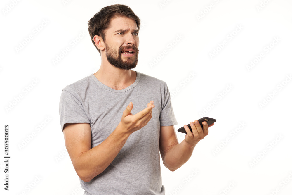 young man texting on mobile phone young man texting on mobile phone