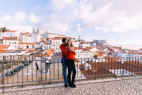 Lisbon, Portugal - 20 January, 2019. the guy hugs the girl from