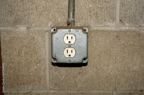 Old plug on wall