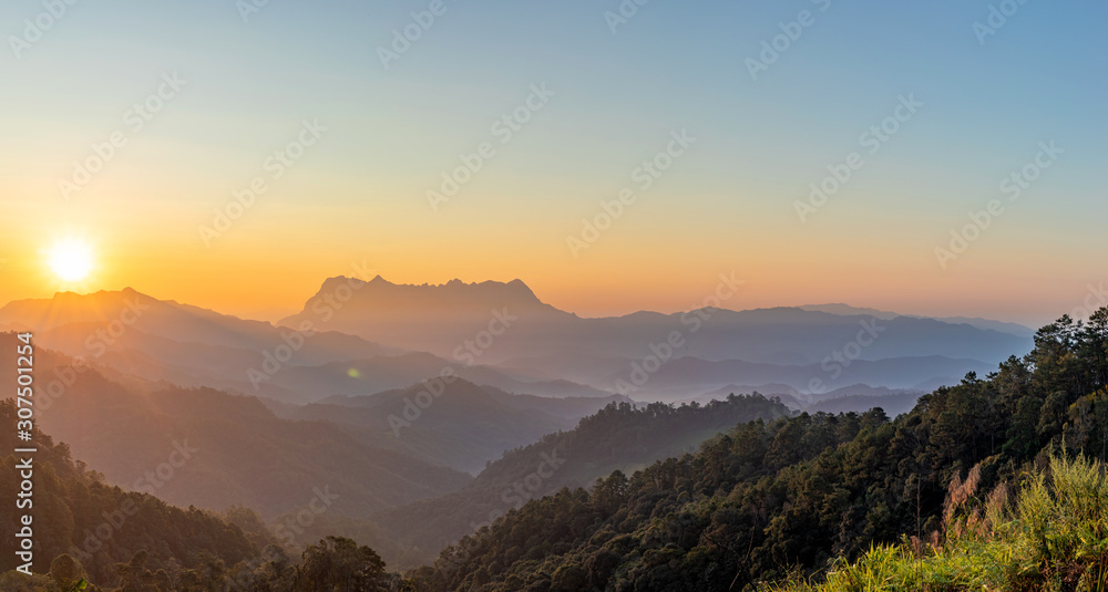 Obraz premium Panoramic mountain layers line at morning colorful sky background, landscape