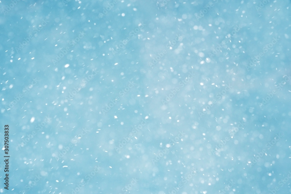 Winter christmas background, blizzard, snowfall. Winter landscape with falling shiny snow