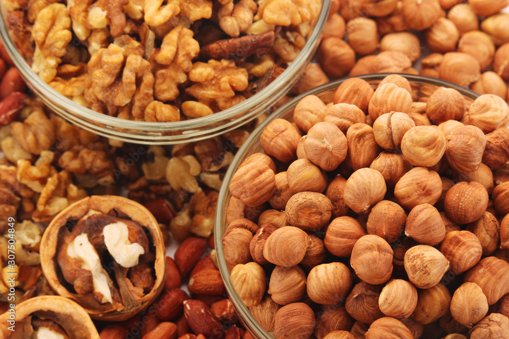 Different nuts in glass cups Different nuts in glass cups