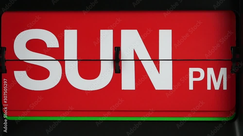 Close-up Slow Motion, Retro flip clock calendar Change label Sunday am.to Sunday pm. On red background, Time concept. Close-up Slow Motion, Retro flip clock calendar Change label Sunday am.to Sunday pm. On red background, Time concept.