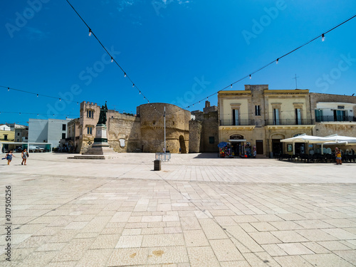 Italy, Province of Lecce, Otranto, String lights hanging over monument of female martyr on Piazza?degli?Eroi photo