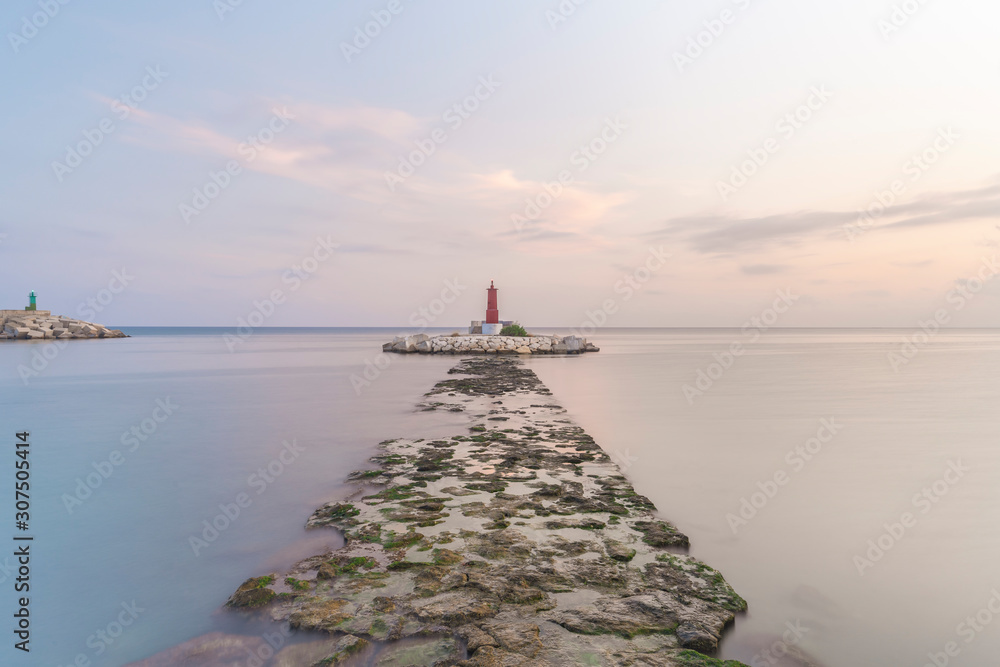 Spain, Alicante, Villajoyosa, scenic view of lighthouse at sunset Spain, Alicante, Villajoyosa, scenic view of lighthouse at sunset