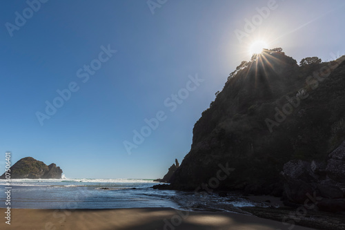 Scenic view of Taitomo Island against clear blue sky during sunny day, Oceania, New Zealand photo