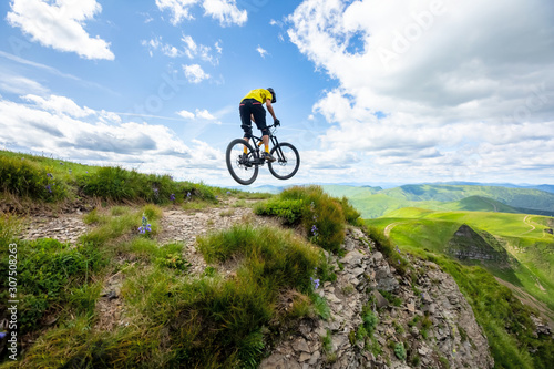 Professional rider is jumping on the bicycle