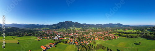 Drone shot of Lenggries with Brauneck against clear blue sky, Bavaria, Germany