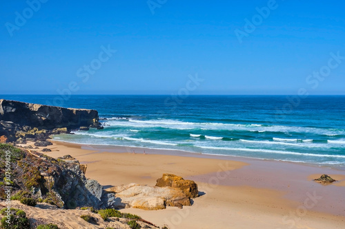 Portugal, Alentejo, Vila Nova de Milfontes, Clear sky over?Malhao beach in summer photo