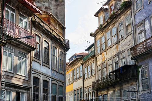 Portugal, Porto, Windows and balconies of old residential buildings photo