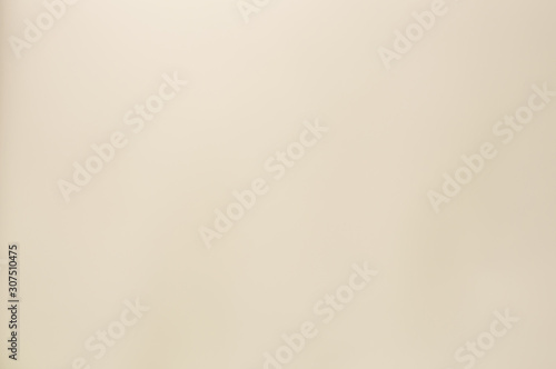 Uneven beige color paper texture. Flat lay, Close-up. Abstract background for design with empty copy space for text.