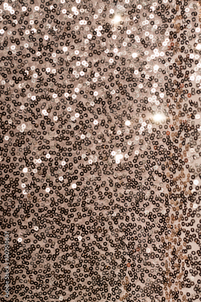 Fototapeta premium Dark gold sequins fabric pattern texture. Fashion abstract background for design.