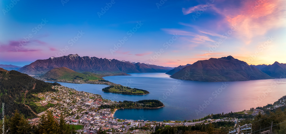 Panoramic shot of Queenstown and Lake Wakatipu against sky during sunset, Queenstown, New Zealand