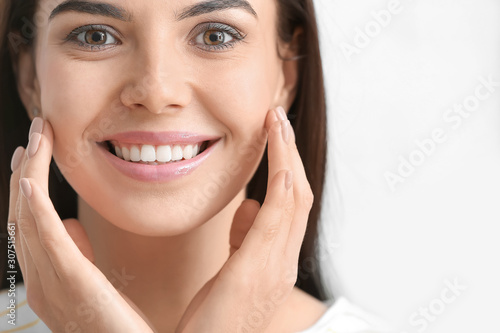 Beautiful young woman with ...