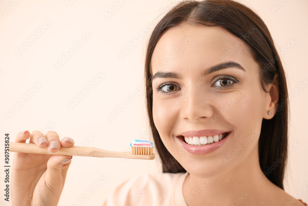 Beautiful young woman with tooth brush on light background Beautiful young woman with tooth brush on light background
