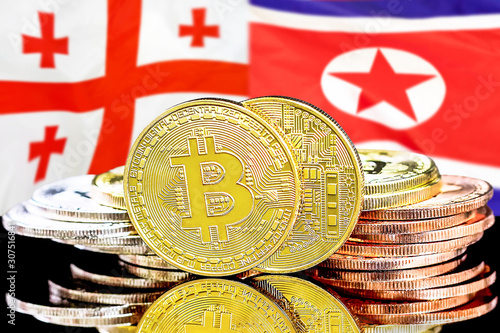 Concept for investors in cryptocurrency and Blockchain technology in the Georgia and North Korea. Bitcoins on the background of the flag Georgia and North Korea.