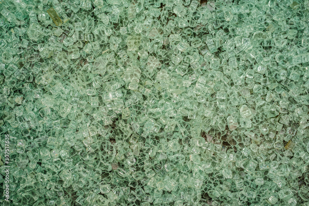 Exploded tempered glass pieces on ground from bus stop Exploded tempered glass pieces on ground from bus stop