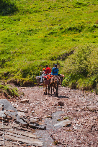 Familly trekking in high mountain of the Aït Bouguemez valley in Morocco
