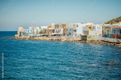 Fototapeta Naklejka Na Ścianę i Meble -  Cafes and restaurants by the sea on the Nisyros island