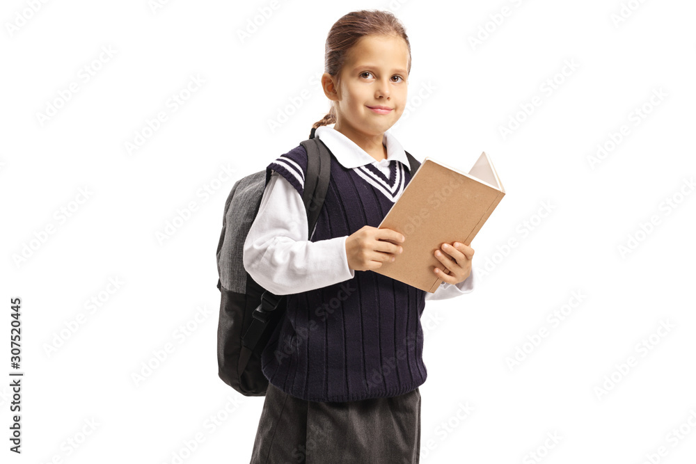 Schoolgirl reading a book and looking at the camera Schoolgirl reading a book and looking at the camera