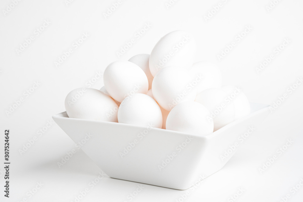 Fresh White Eggs Piled On White Square Bowl Fresh White Eggs Piled On White Square Bowl