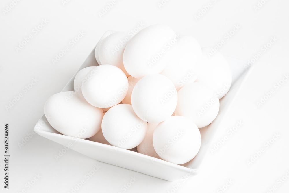 Fresh White Eggs Piled On White Square Bowl Fresh White Eggs Piled On White Square Bowl